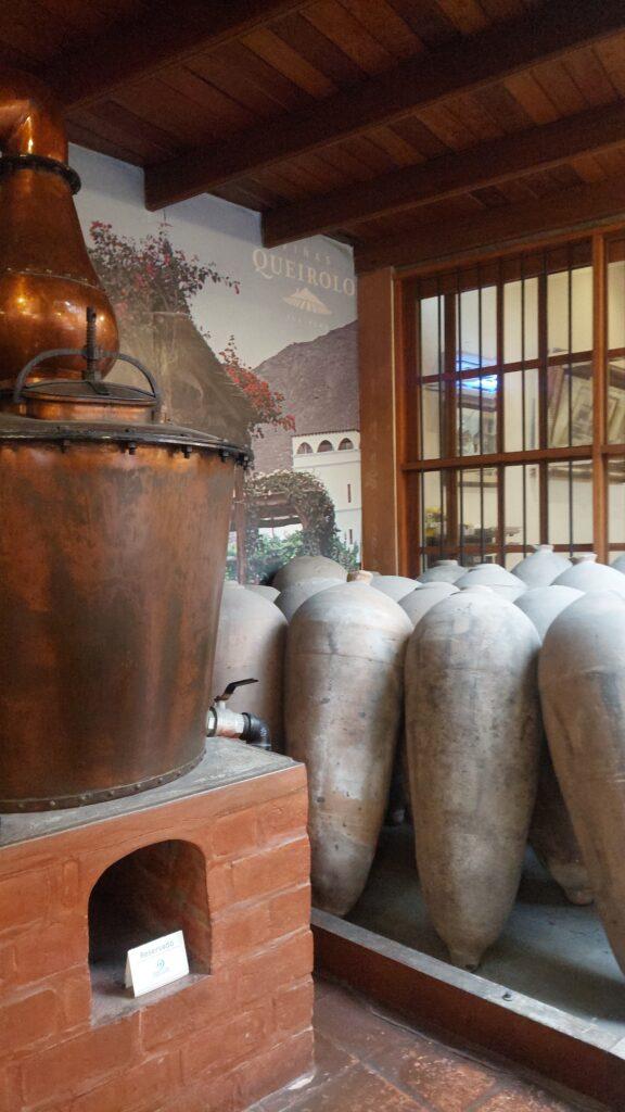 Old copper still and ceramic jugs