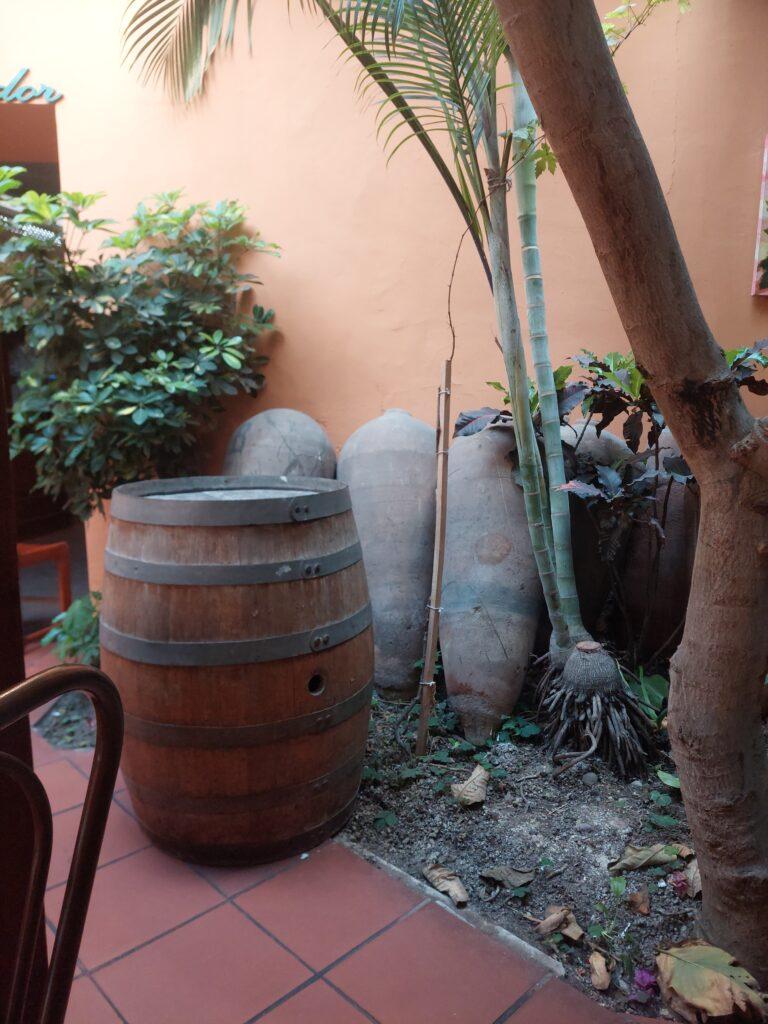 Old barrel and ceramic jugs at Bolivariano Restaurant Pueblo Libre