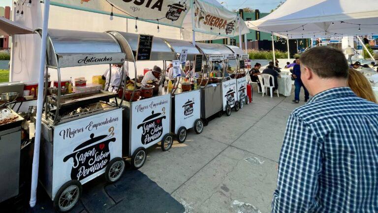 A row of street food carts in Lima, Peru