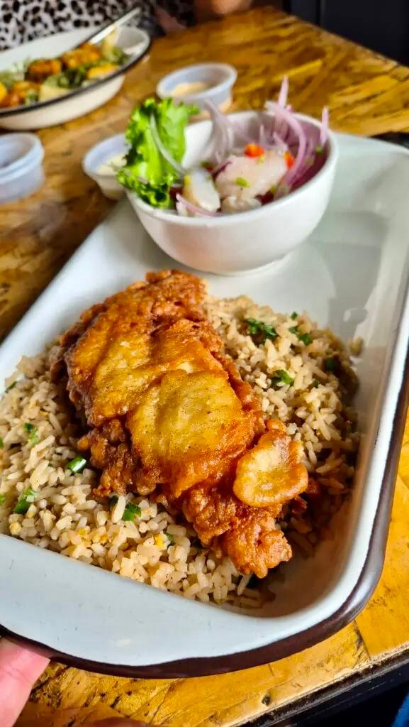 Peruvian Nikkei chaufa rice, Chicharron de Pescado and served with a side of fresh ceviche at Rioba 901.